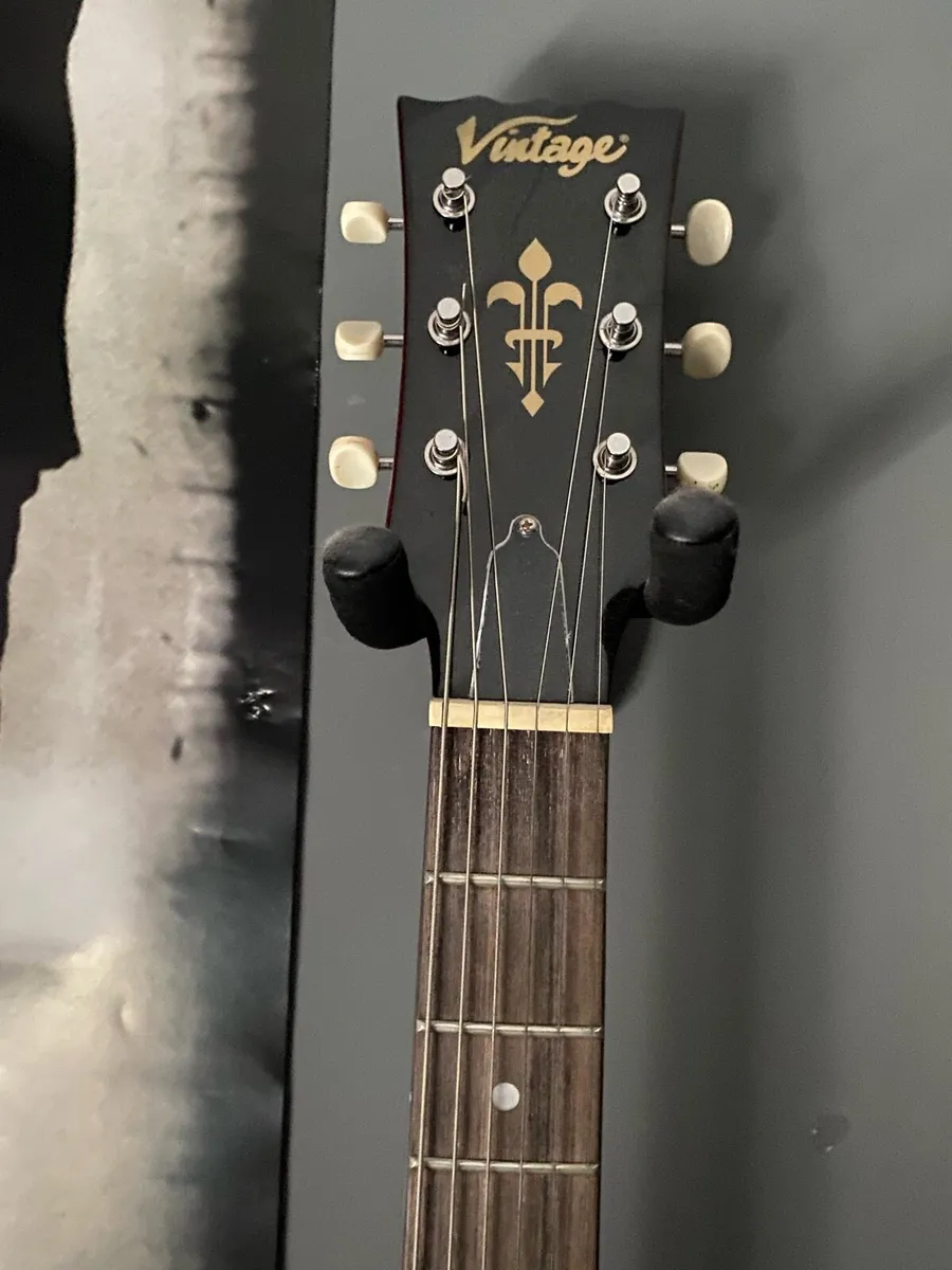 red and black vintage electric guitar - Image 2