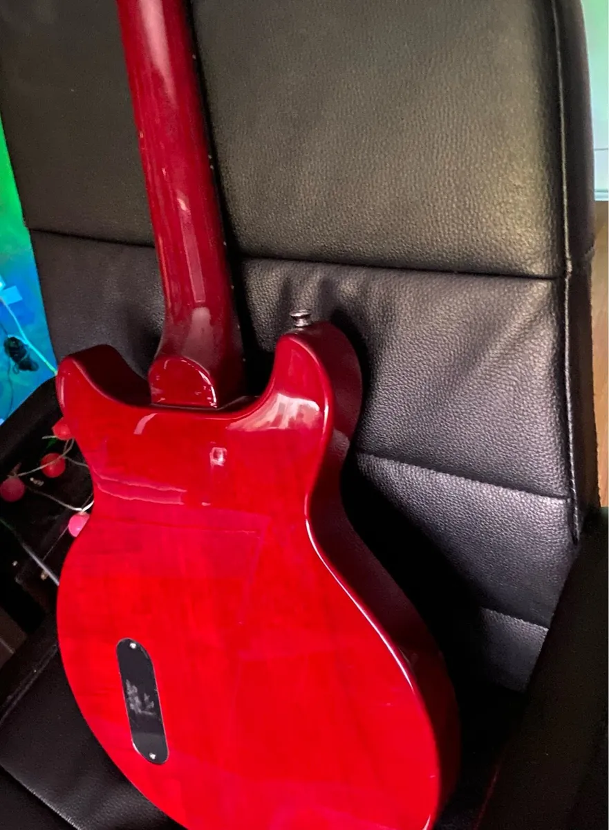red and black vintage electric guitar - Image 3