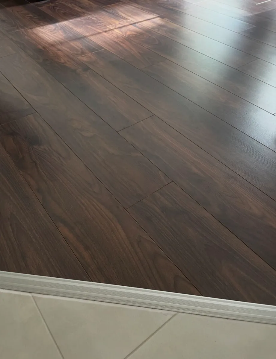 Dark Walnut Laminate Flooring - Image 1