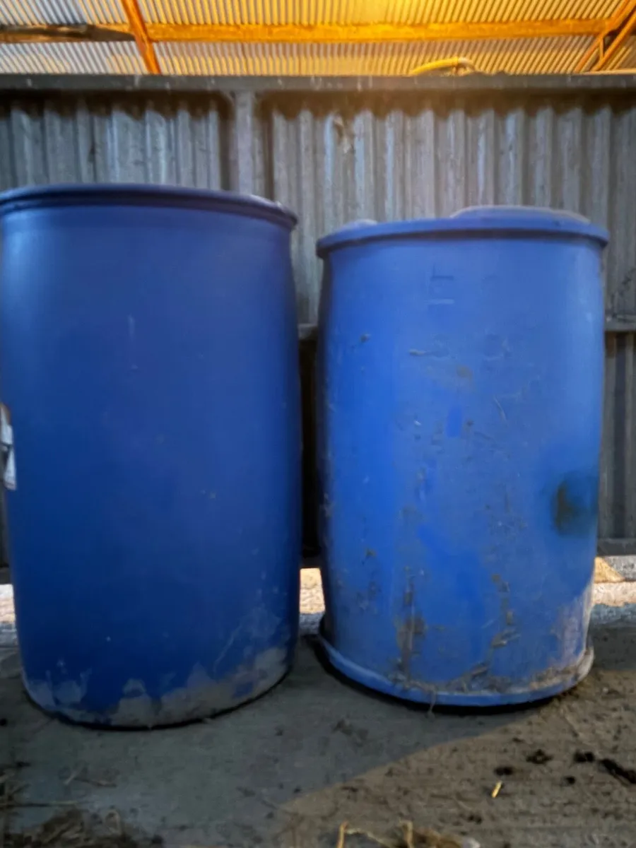 Blue plastic barrels - Image 1