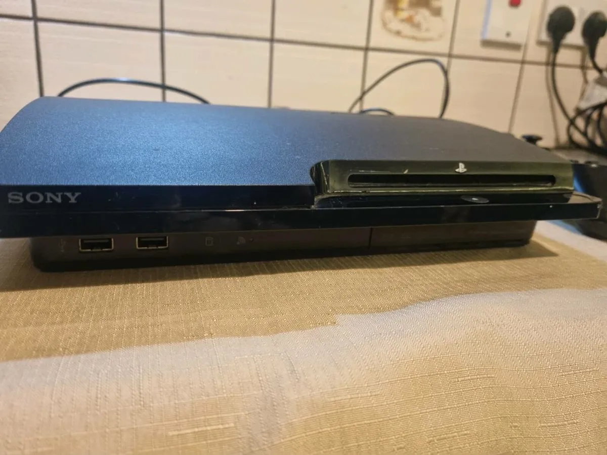 PlayStation 3 Slim Bundle – 2 Controllers + 8 Game - Image 1