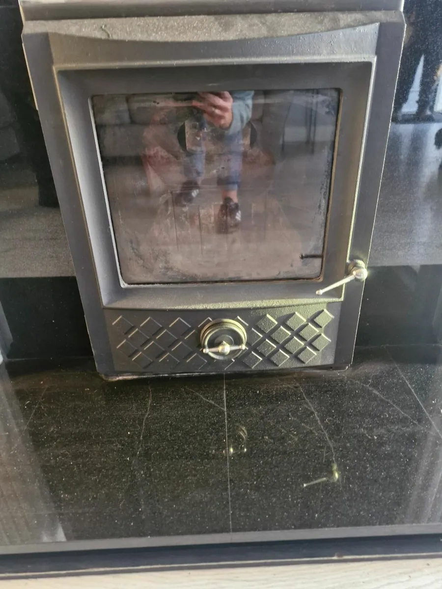 5Kw Insert Stove with black Granite Surround