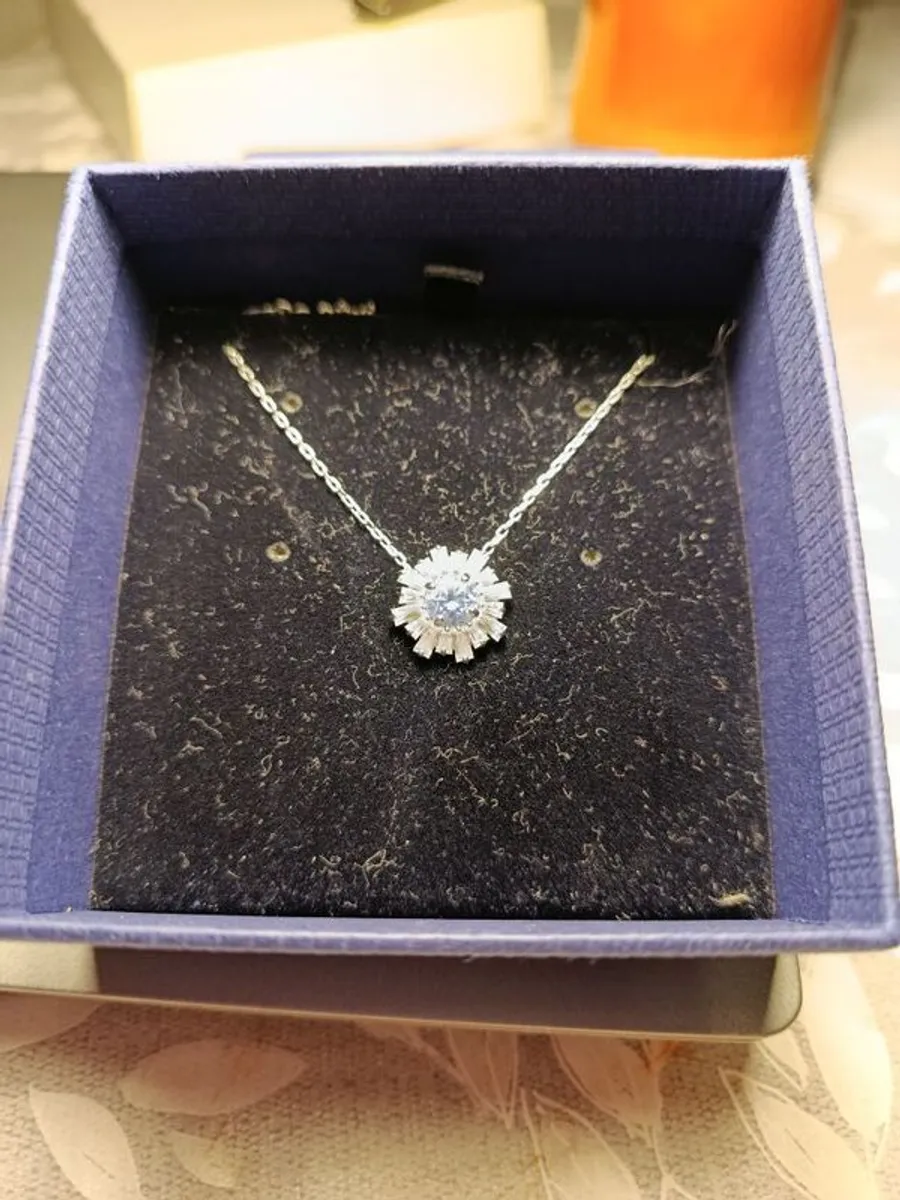 Swarovski pendant. Blue stone and diamond type stones. New, never worn.