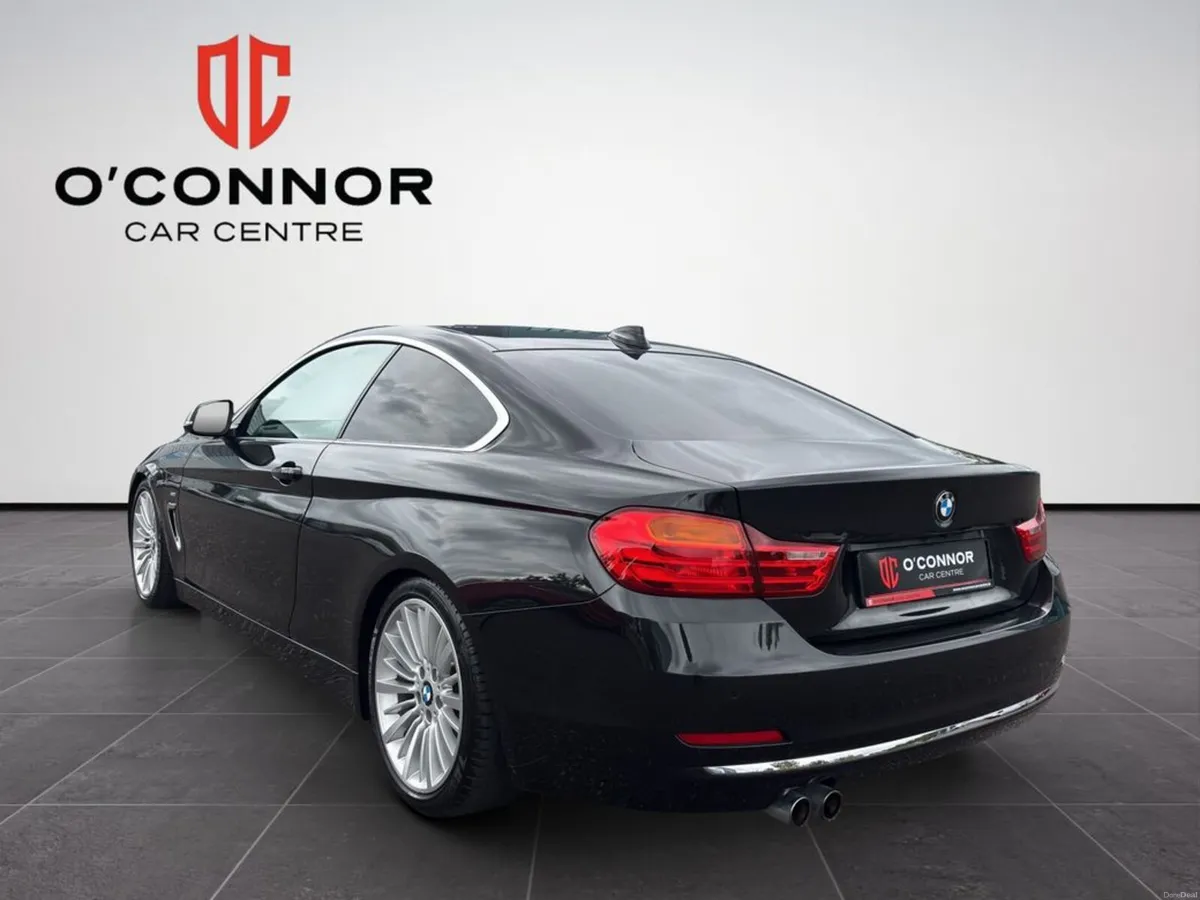 BMW 4-Series Black outside, tan inside. classy fro - Image 4