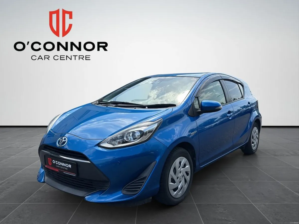 Toyota Aqua Blue on the outside, green at the pump - Image 1