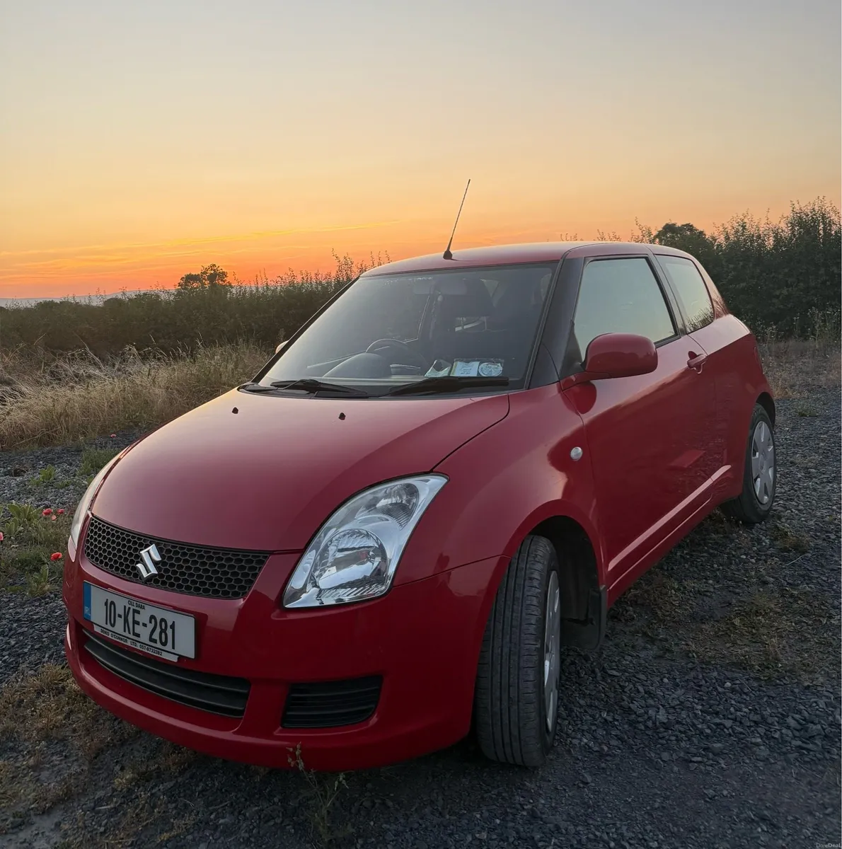 Red Suzuki Swift - Image 1