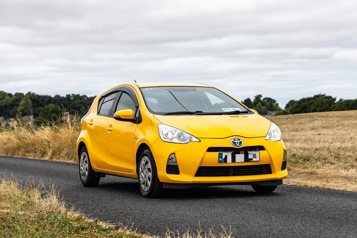 Bright Toyota Aqua 2014, Excellent Condition - Image 1