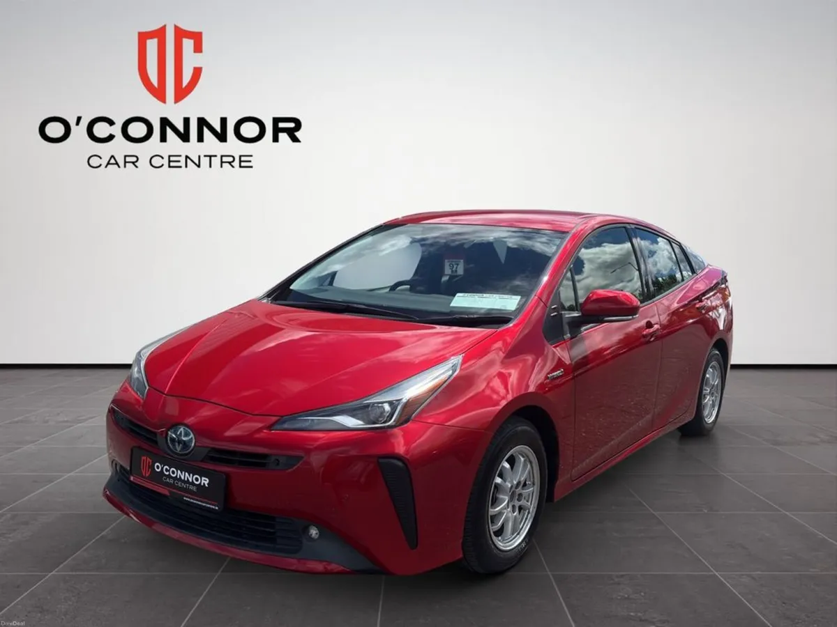 Toyota Prius Red Prius energy — passing petrol sta - Image 1