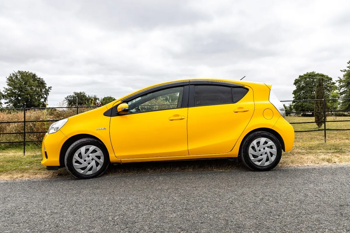 Bright Toyota Aqua 2014, Excellent Condition - Image 2