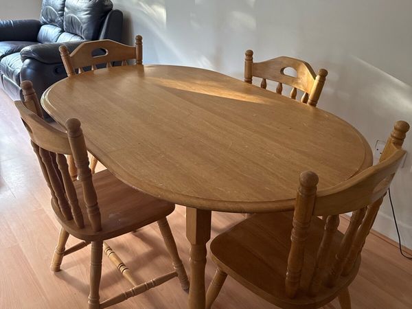 Sturdy wooden dining table and four chairs set - Main image