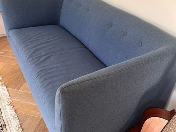 Blue two-seater sofa - button back detail - Main image