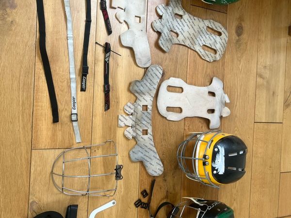 Assortment of hurling helmets and accessories - Main image