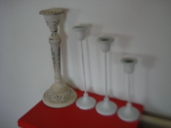 4 WHITE METAL CANDLE STICK HOLDERS. - Main image