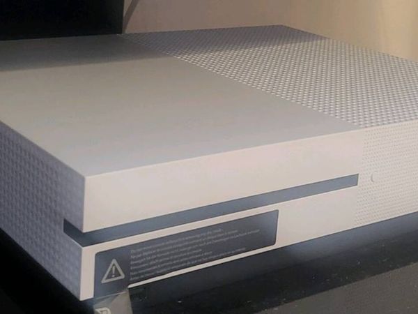 Xbox One S with games. - Main image