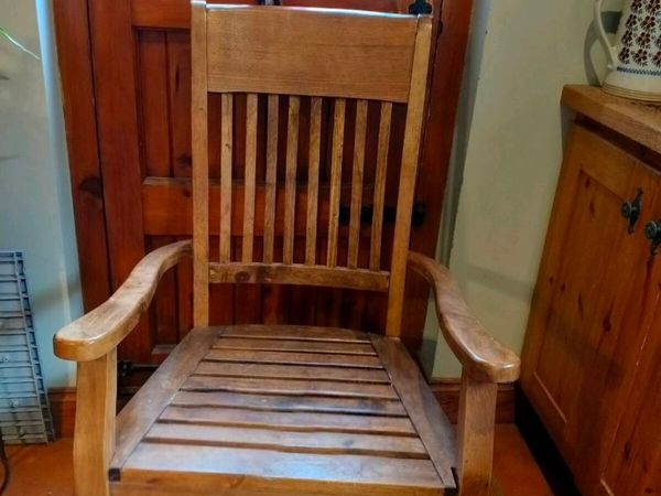 classic solid wood rocking chair with a slatted ba - Main image