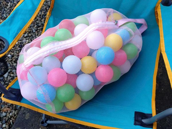 Lightweight Coloured Plastic Balls In Net Sack. - Main image