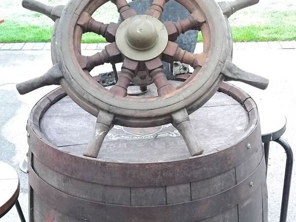 Vintage wooden ship's wheel with a brass center - Main image