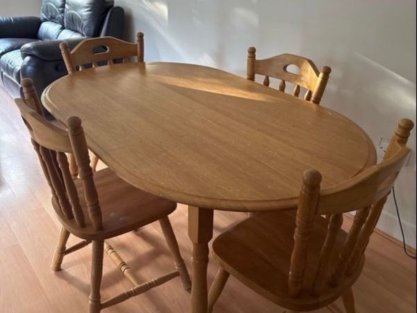 Sturdy wooden dining table and four chairs set - Main image