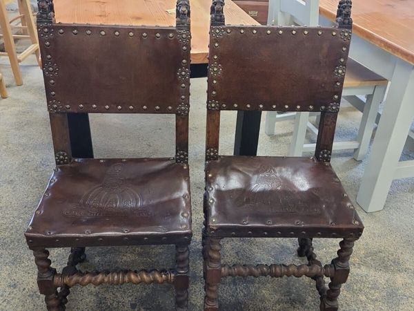 Pair early 1900s embossed leather chairs - Main image