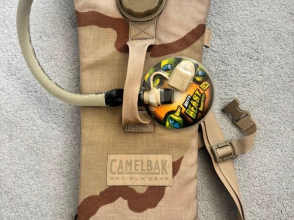 Camelbak maximum gear hydration pack in desert - Main image