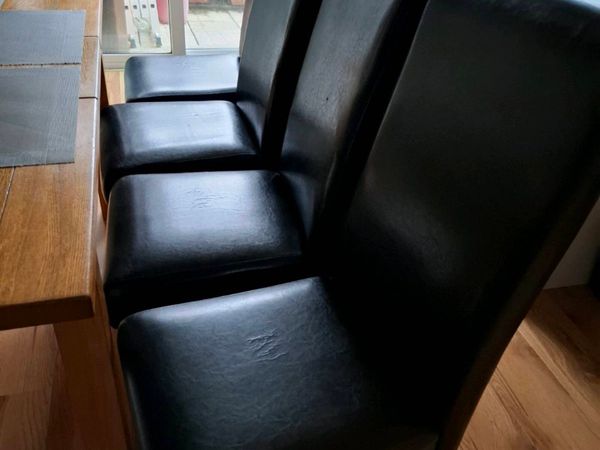 4 Black leather style kitchen chairs. - Main image
