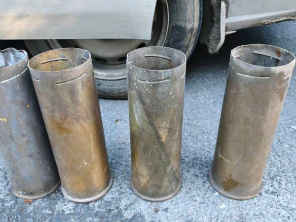 four spent, empty brass artillery shell casings
13 - Main image