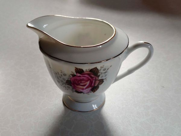 Milk Jug & 4 Saucers (used). - Main image