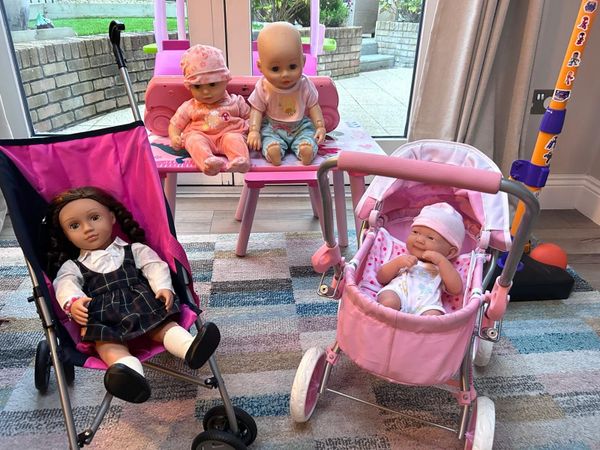 Two toy doll prams and 4 baby dolls - Main image