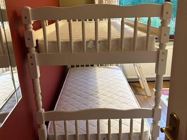 White wooden bunk beds with mattresses - Main image