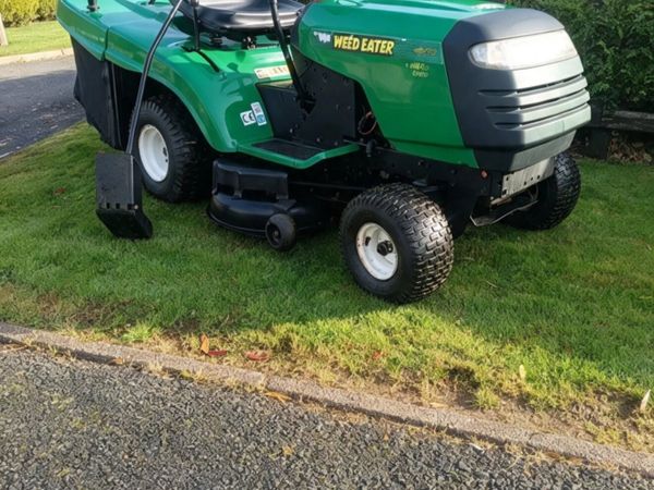 Weed eater made by husquvarna petrol ride on lawnm - Main image