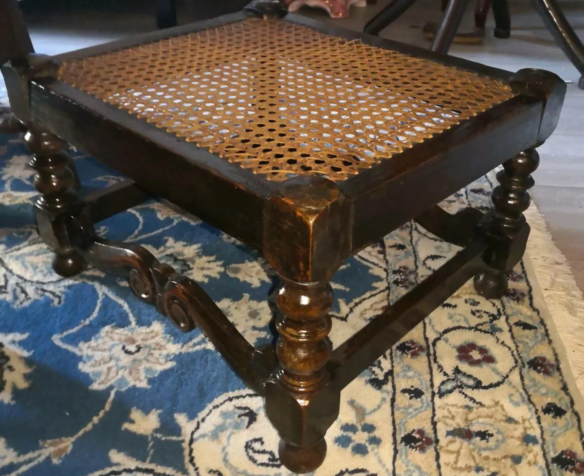 Antique solid wood foot rest with cane top - Image 1