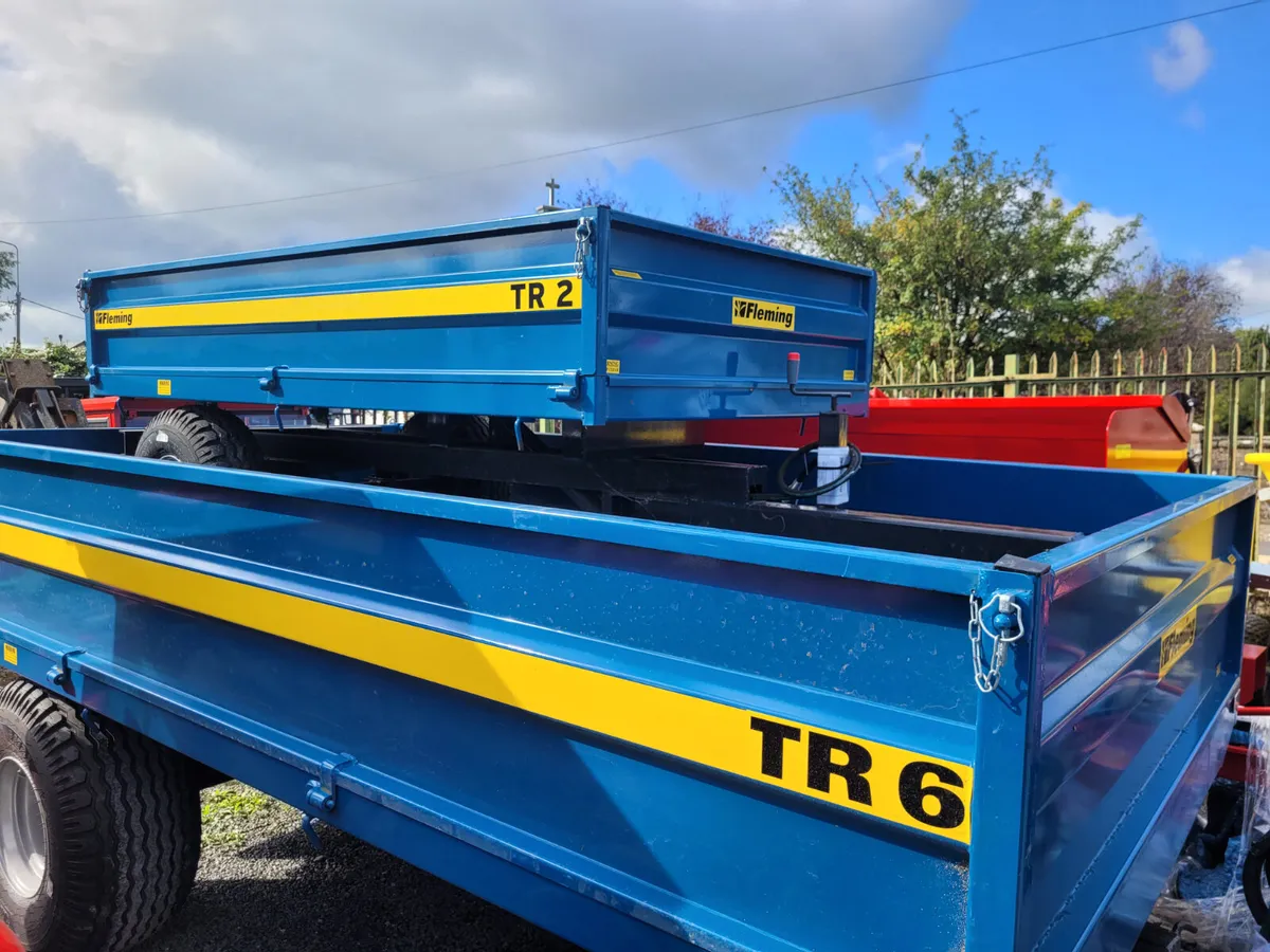 Tractor tipping trailers - Image 1
