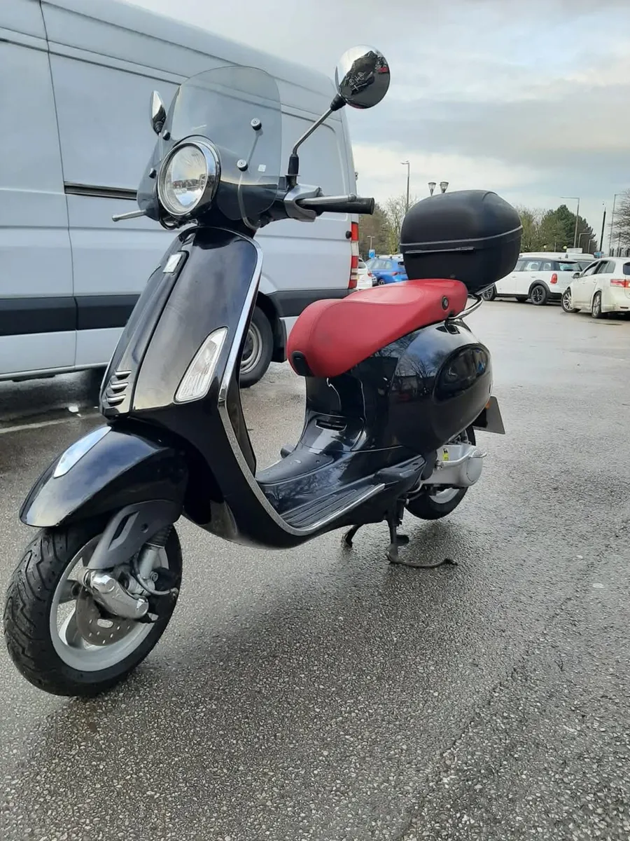 Vespa 50 and RA scooters at scooter island - Image 1