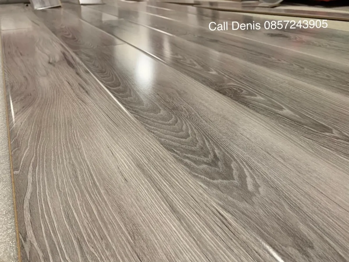 New 12mm High Gloss Grey Laminated Flooring - Image 1