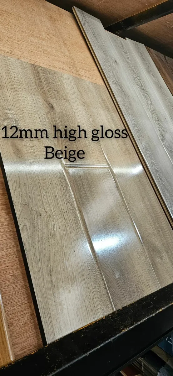 Durable 12mm gloss Finish Laminated Click Flooring - Image 1