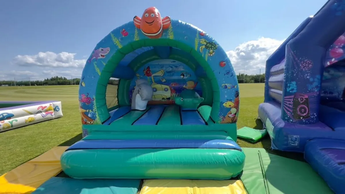 bouncy castle 12 x 12 with gibbons blower + mats - Image 1