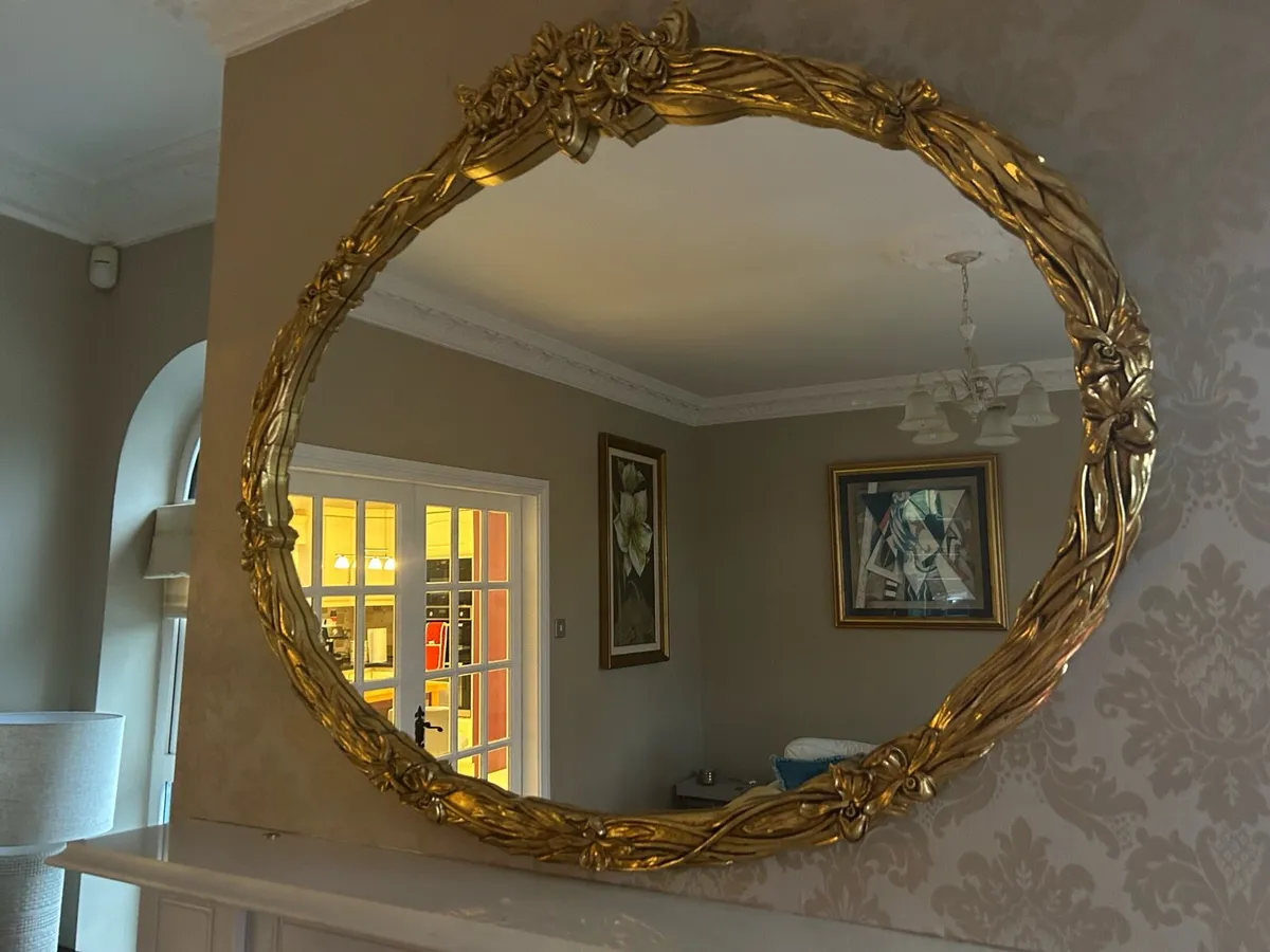 A large gilt framed oval wall mirror - Image 1
