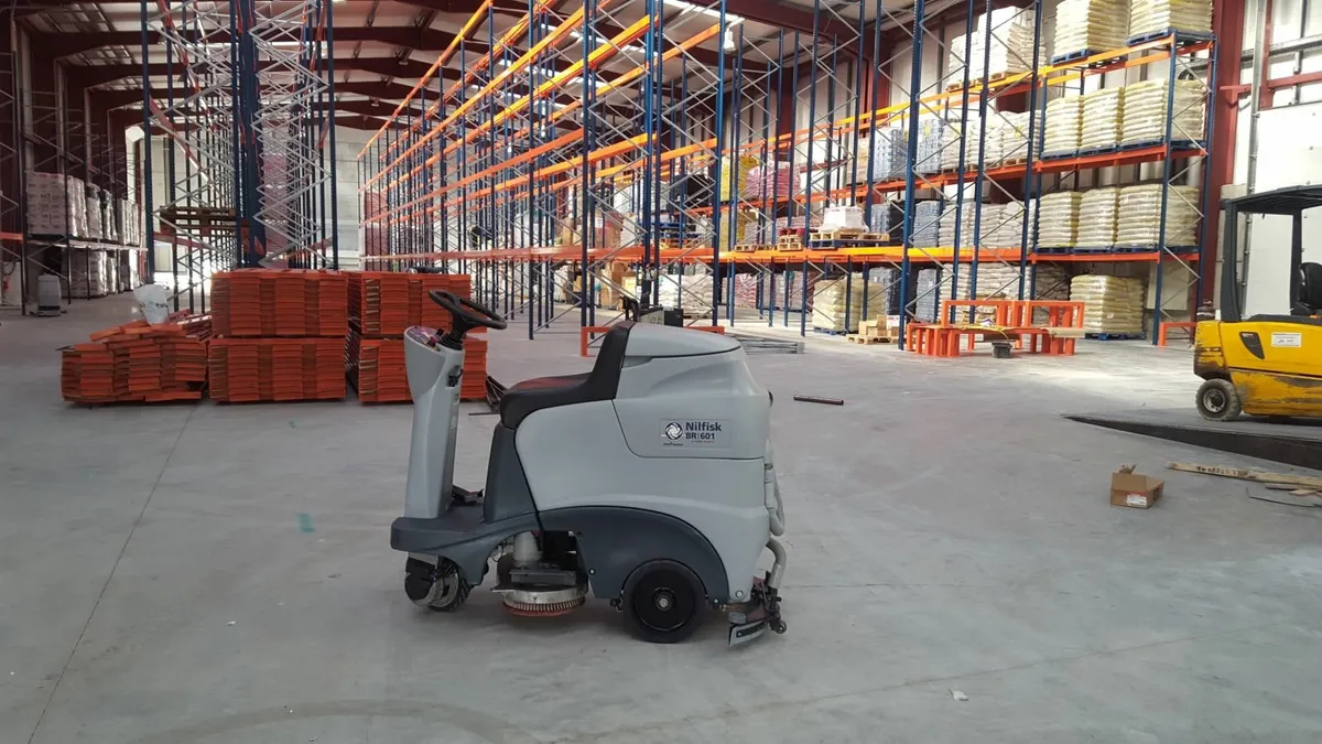 Reconditioned Nilfisk BR601 Ride-On Scrubber Dryer - Image 1