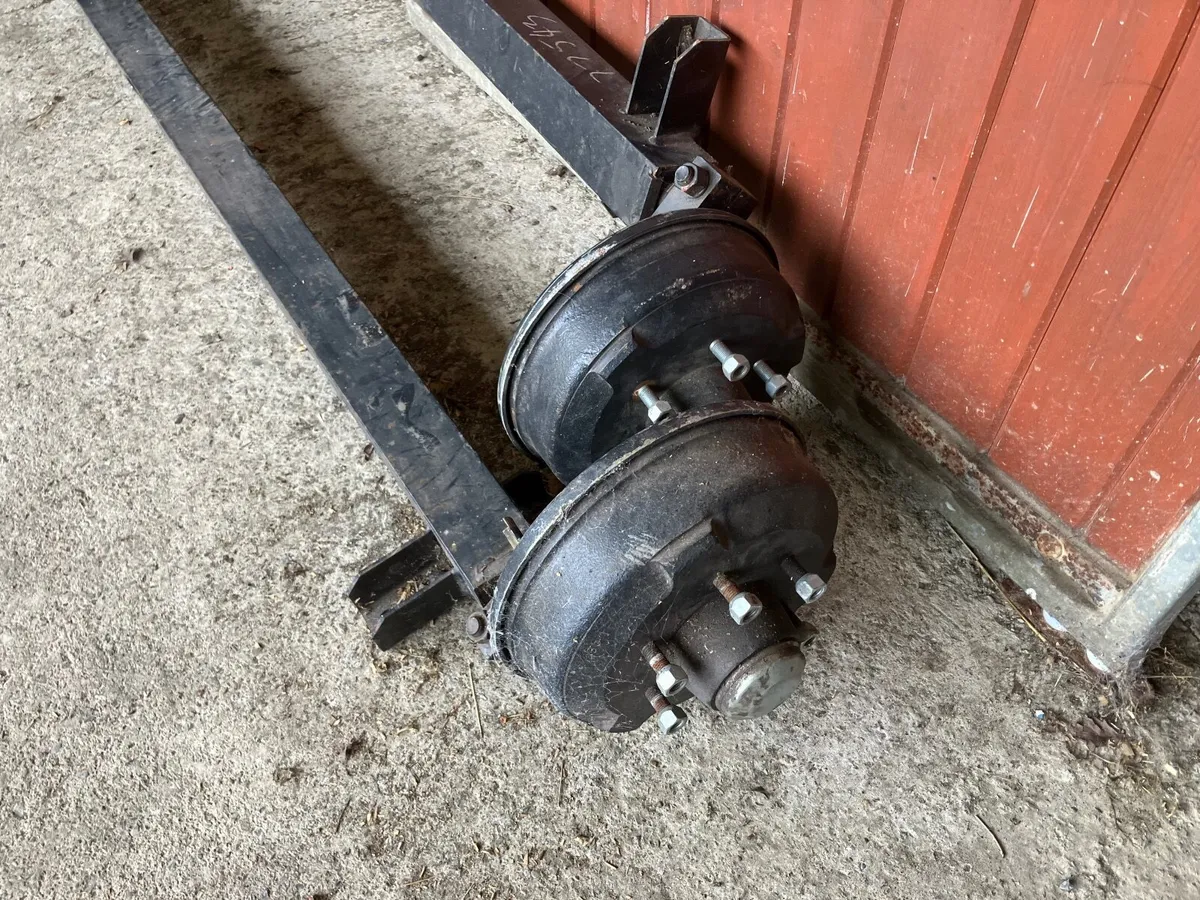 PAIR  NEW TRAILER AXLES 1800KG  EACH BRAND NEW - Image 1