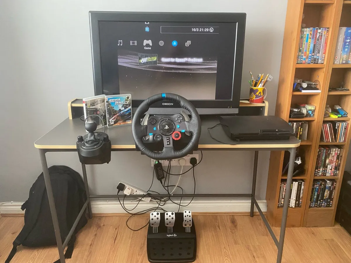 PlayStation 3 with steering wheel - Image 1