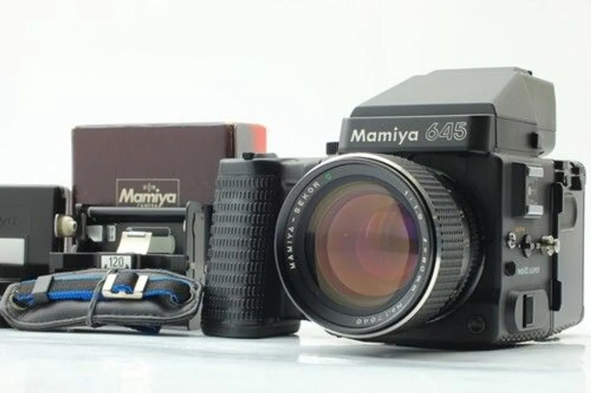 Mamiya 645 Super Kit; Near Mint Condition Recently serviced Mamiya 645 Super with Tamron Sekkor 80mm 1.9 lens; Mamiya 645 AE Prism Finder; Mamiya 645 Super Waist Finder Viewer with magnifier; Mamiya 645 Super Motor Power Winder Grip; Darkslide; Extra Film - Image 1