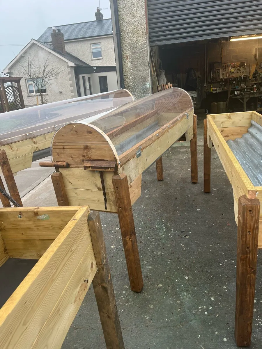 Raised beds bird feeders and cast iron benches - Image 3