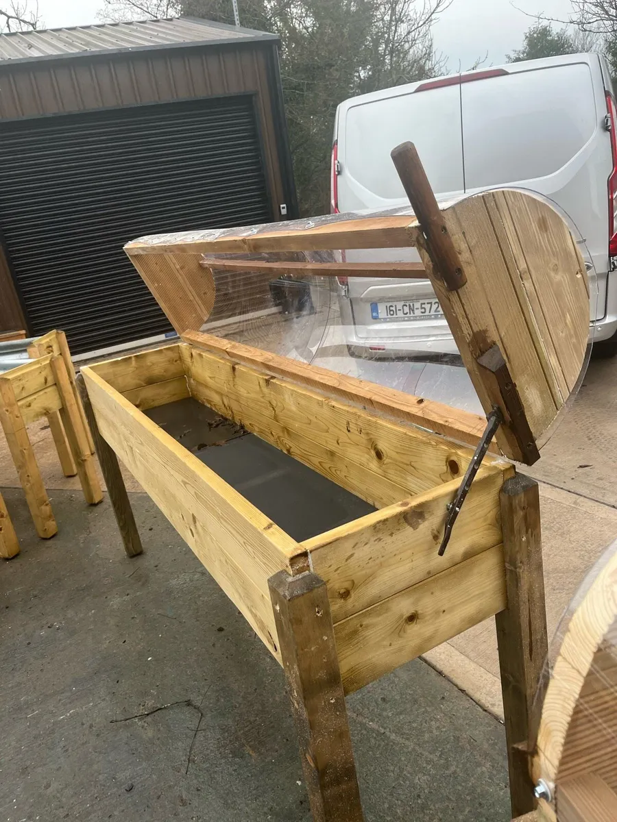 Raised beds bird feeders and cast iron benches - Image 2