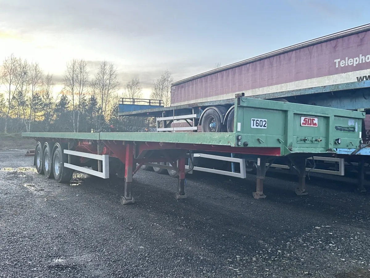 2002 SDC TROMBONE FLATBED TRAILER - Image 1