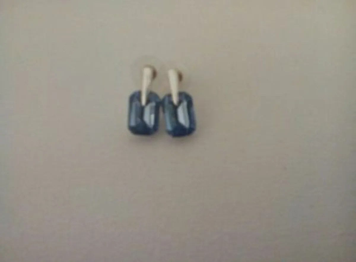 Polished Metal and Blue Stone Set Earrings.