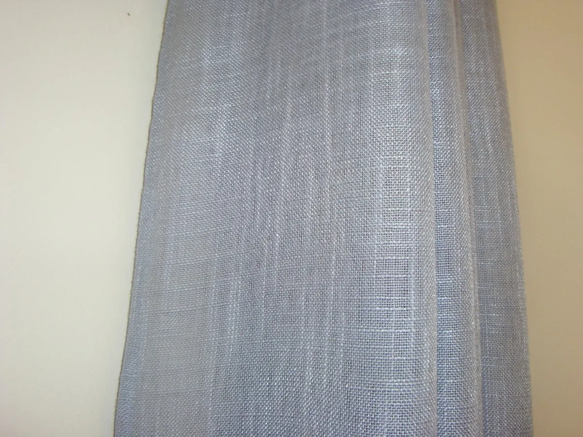 TWO panels of grey eyelet curtains W132cm x H226cm - Image 2