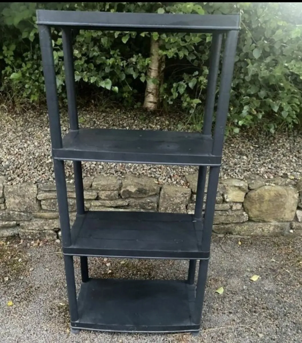 Black plastic interlocking 4 tier shelfing unit