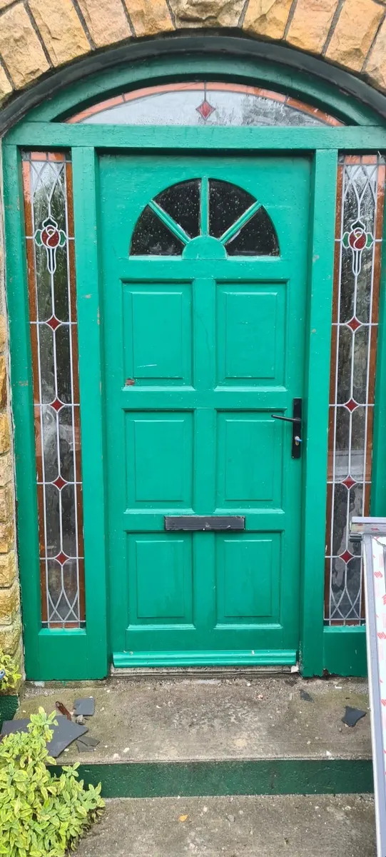 Solid Teak front door with decorative leaded sides