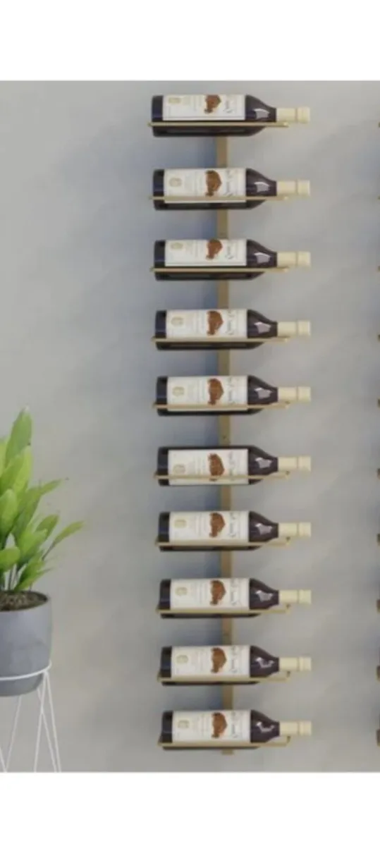 Modern hanging wine rack in gold color - Image 1