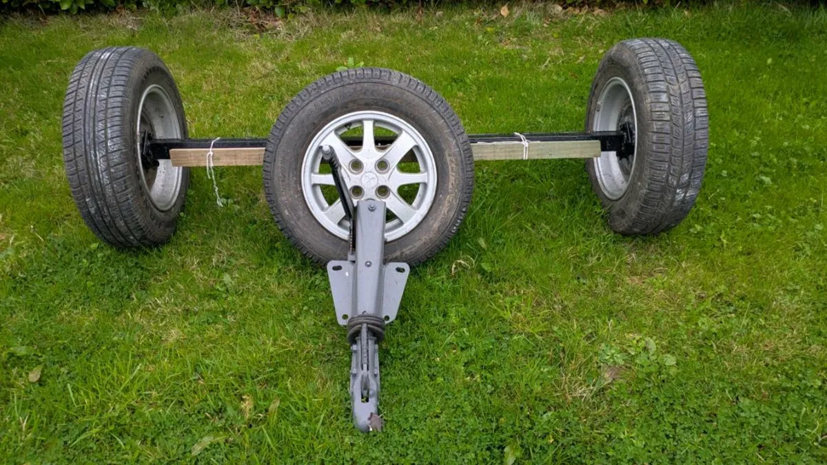 Car trailer axels with spare wheels - Image 1